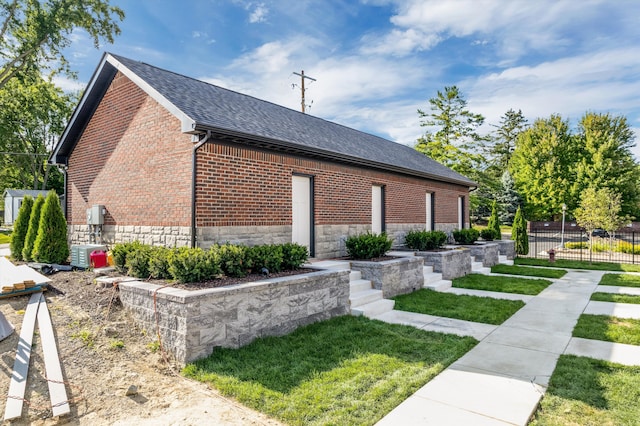 view of home's exterior with a yard