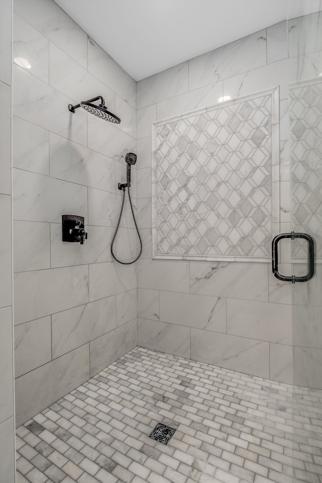 bathroom with a shower with shower door