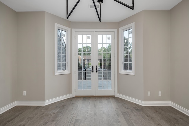 entryway with french doors and hardwood / wood-style floors