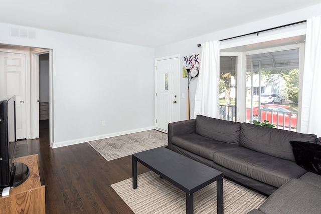 living room with dark wood-type flooring