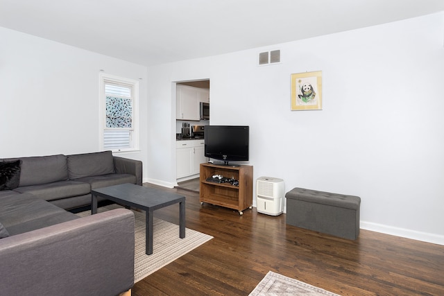 living room featuring dark hardwood / wood-style floors