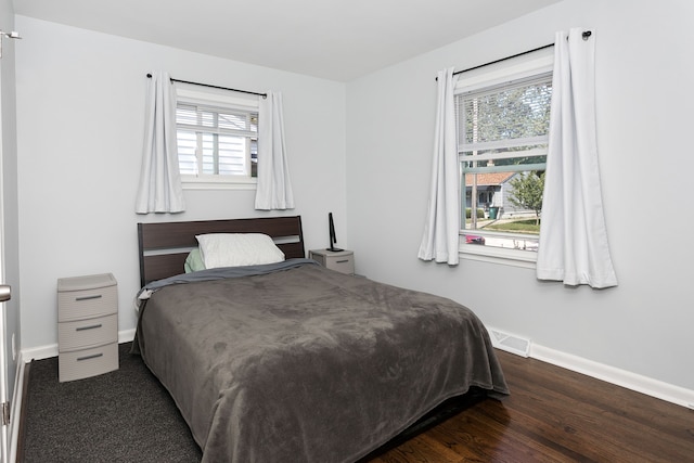 bedroom featuring dark wood-type flooring