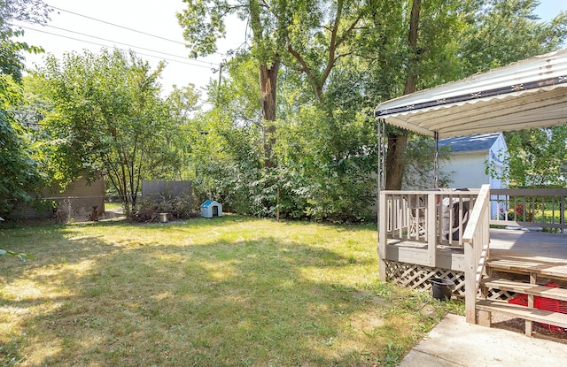 view of yard with a wooden deck