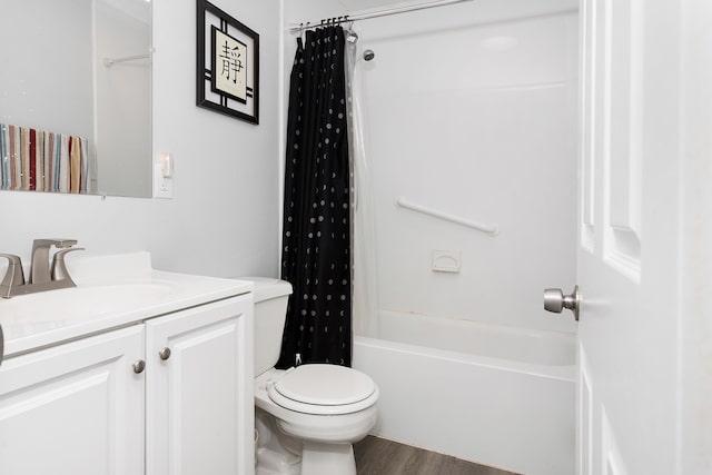 full bathroom with vanity, hardwood / wood-style flooring, toilet, and shower / bathtub combination with curtain