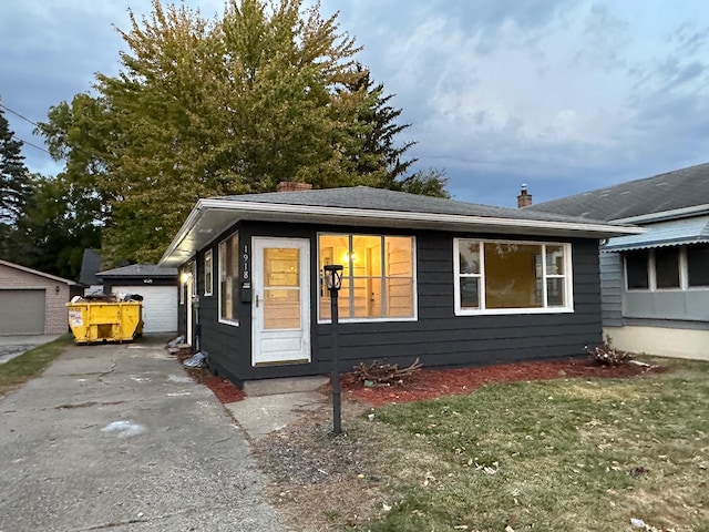 view of front of house with an outbuilding and a garage