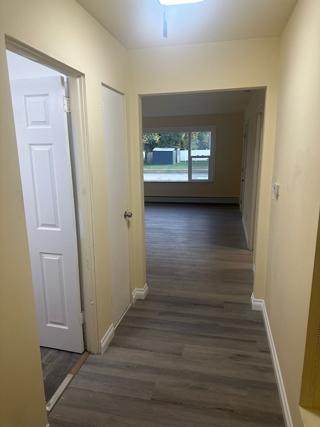 hallway featuring dark hardwood / wood-style floors