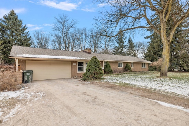 ranch-style house featuring a garage