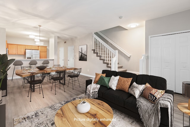 living room with light hardwood / wood-style flooring