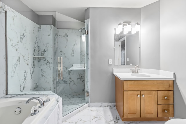 bathroom with vanity and separate shower and tub