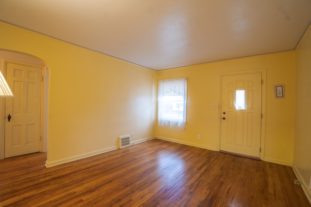 foyer featuring dark wood-type flooring