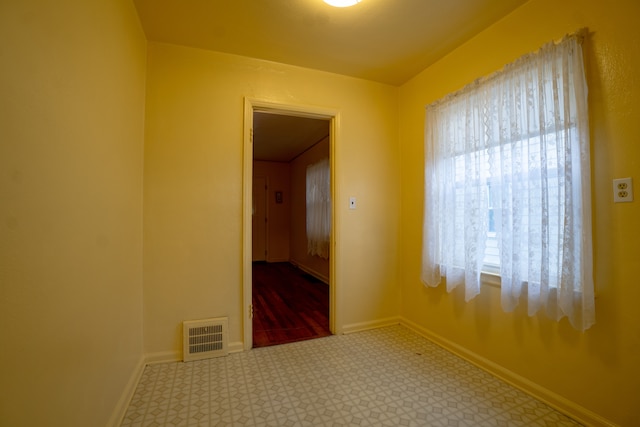 unfurnished room with carpet floors