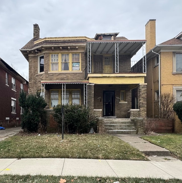 view of front of house with a balcony