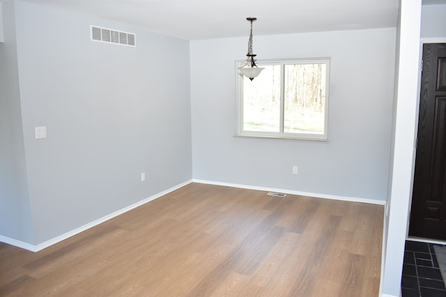 unfurnished dining area with hardwood / wood-style floors