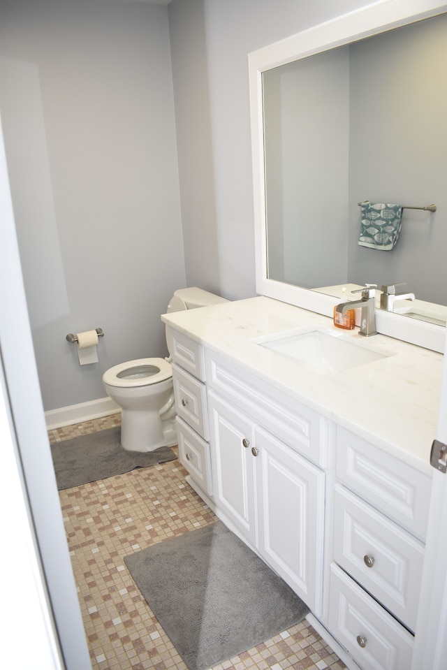 bathroom with vanity and toilet