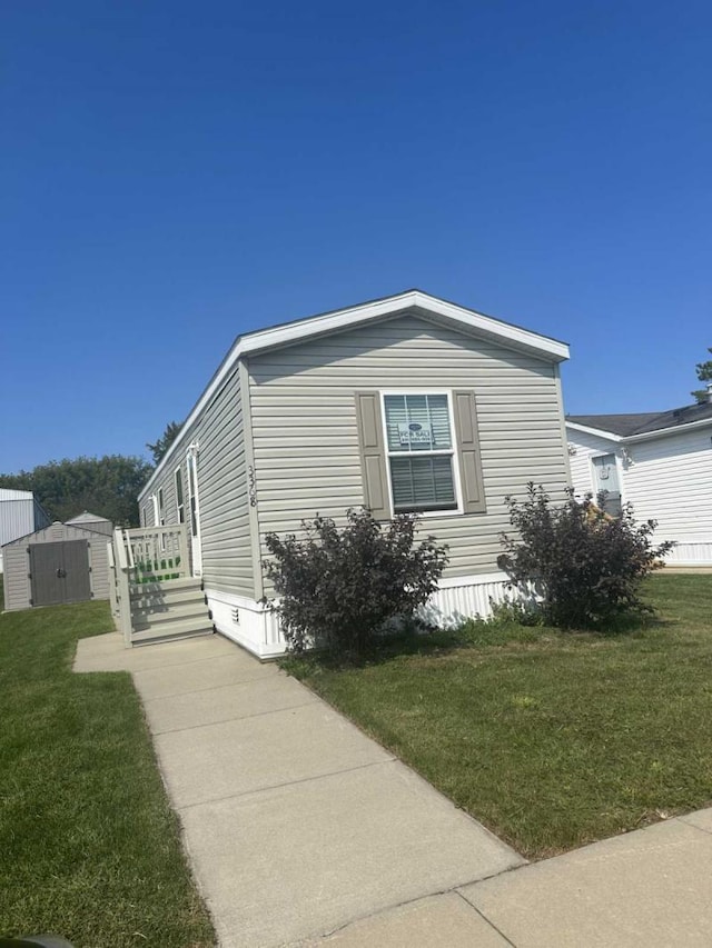 view of property exterior with a yard