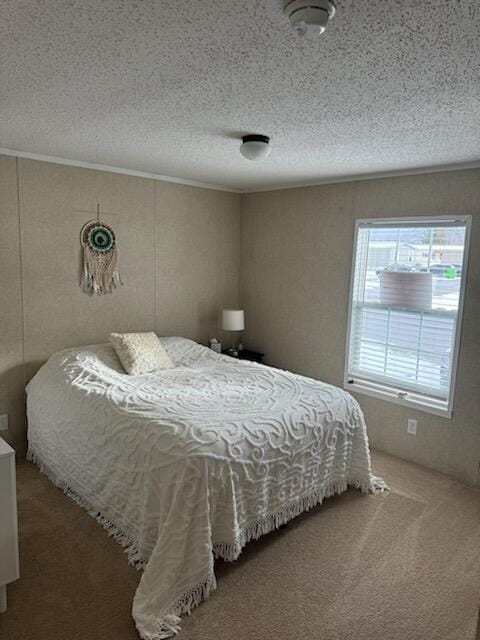 carpeted bedroom featuring a textured ceiling