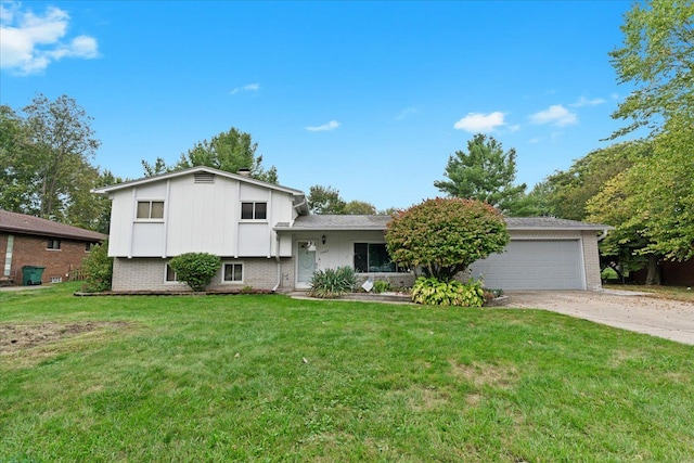 tri-level home with a garage and a front lawn