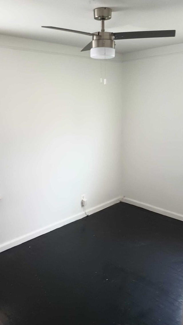 empty room featuring baseboards