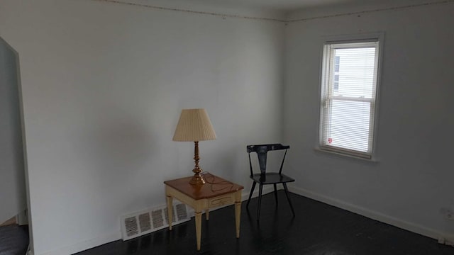 sitting room featuring visible vents and baseboards