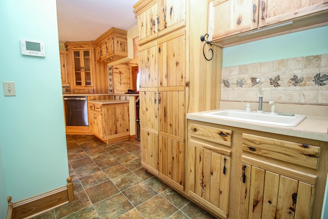 kitchen featuring stainless steel dishwasher and sink