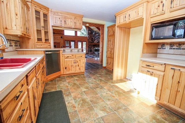 kitchen featuring stainless steel dishwasher and sink