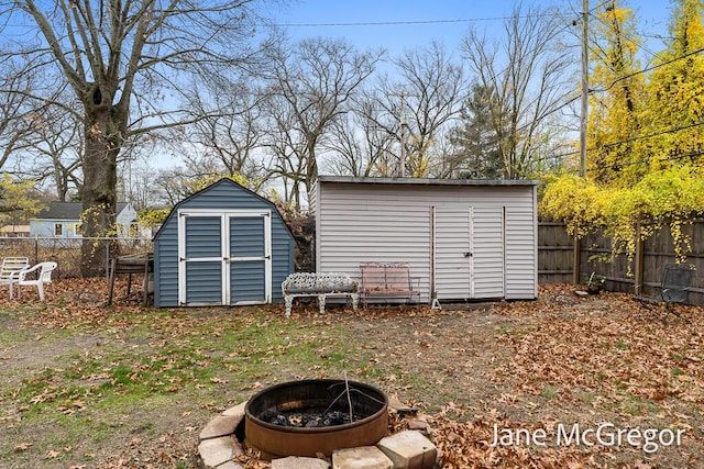 view of outdoor structure featuring an outdoor fire pit