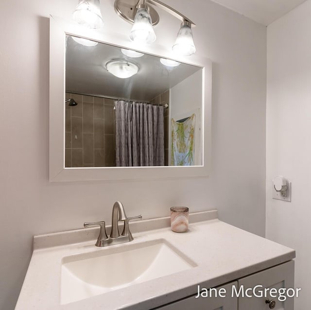 bathroom featuring vanity and walk in shower