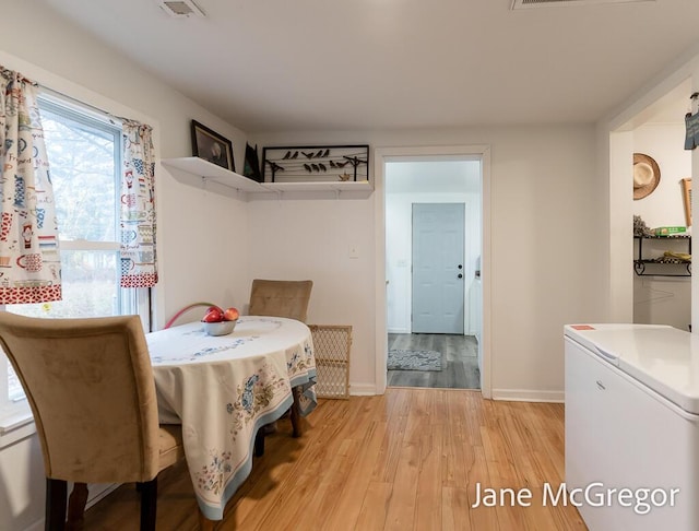 dining room featuring light hardwood / wood-style flooring