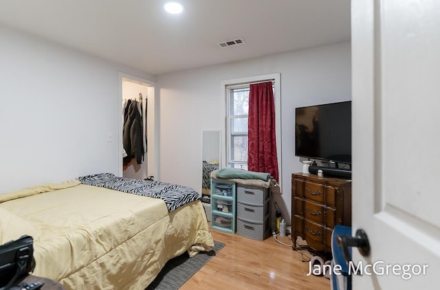 bedroom with hardwood / wood-style floors