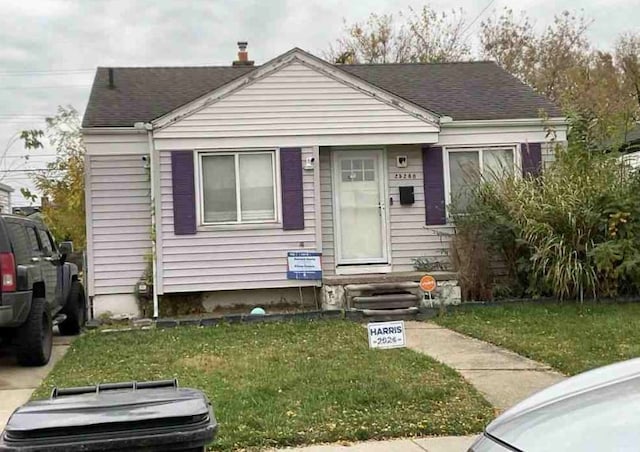 bungalow with a front lawn