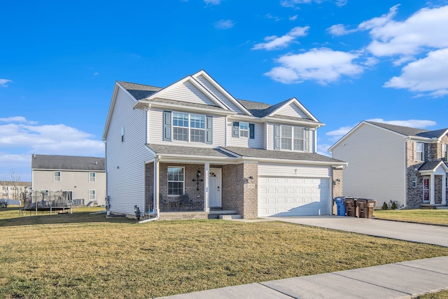 view of front of property featuring a garage, a trampoline, and a front yard