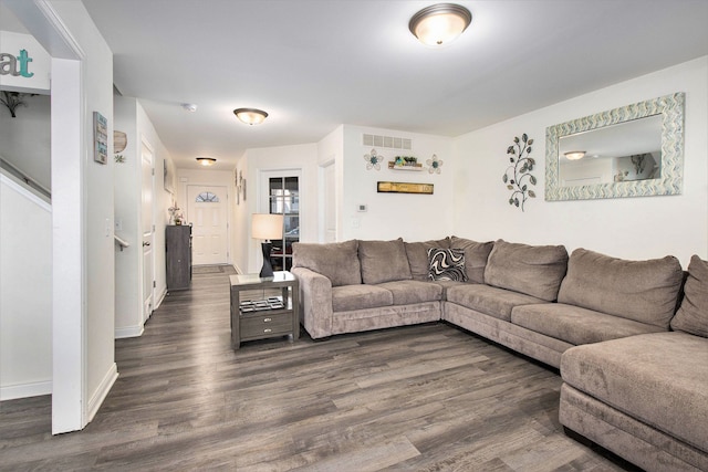 living room featuring dark hardwood / wood-style flooring