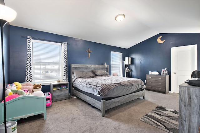 bedroom featuring carpet and lofted ceiling