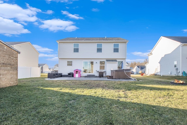 rear view of house with outdoor lounge area, a patio, and a lawn