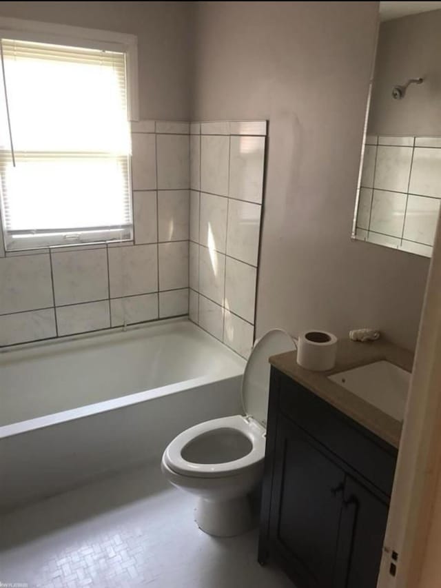 full bathroom featuring vanity, toilet, and bathtub / shower combination