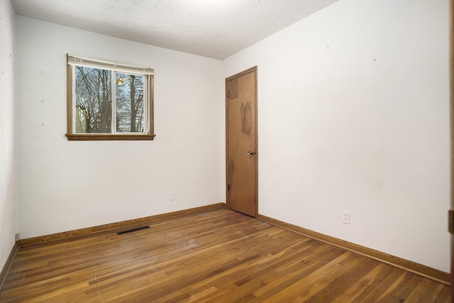 empty room featuring hardwood / wood-style floors