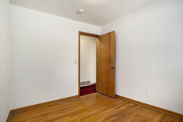 unfurnished room featuring light wood-type flooring