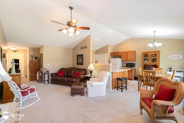 carpeted living room featuring ceiling fan with notable chandelier and lofted ceiling