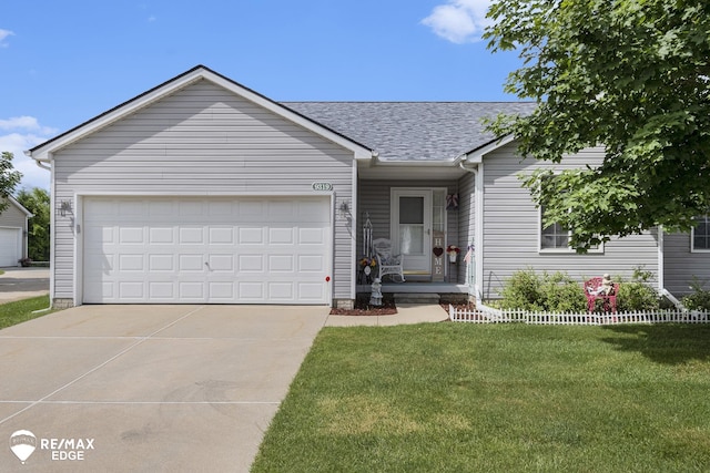 ranch-style house with a front yard and a garage