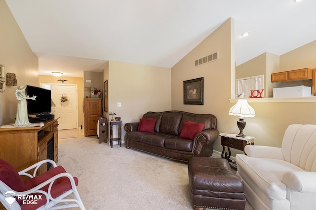 living room featuring light carpet and lofted ceiling