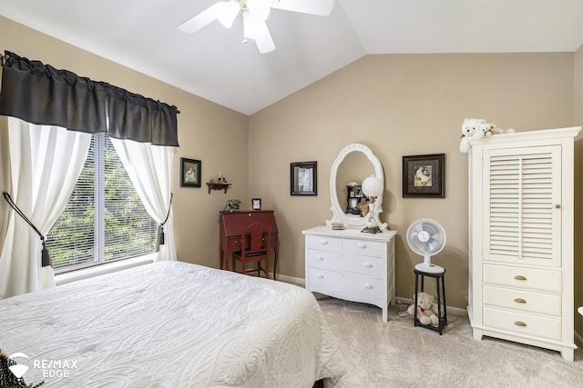 bedroom featuring light colored carpet, vaulted ceiling, and ceiling fan