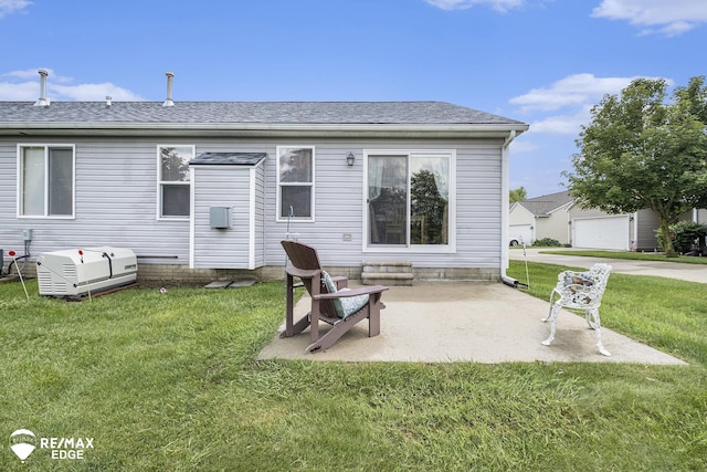 back of house featuring a yard and a patio area