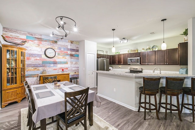 dining room featuring dark hardwood / wood-style flooring and sink