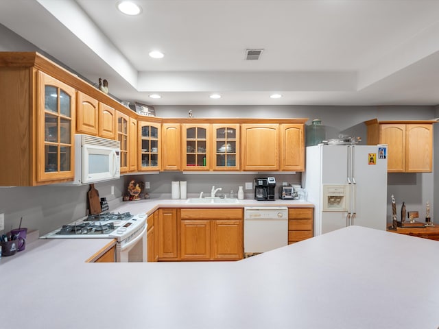 kitchen featuring white appliances and sink