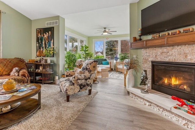 3943 Bungalow Path Unit 54, Saint Joseph, MI 49085 - interior space featuring ceiling fan, light hardwood / wood-style floors, and a stone fireplace