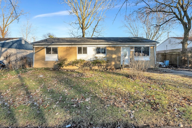 ranch-style house with a front lawn