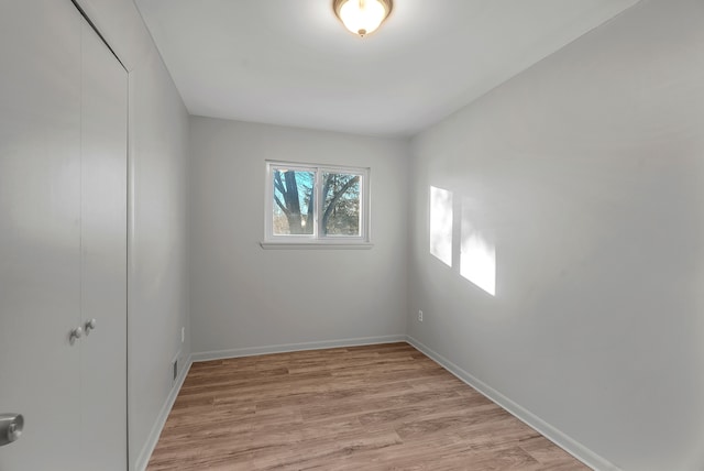 empty room with light wood-type flooring