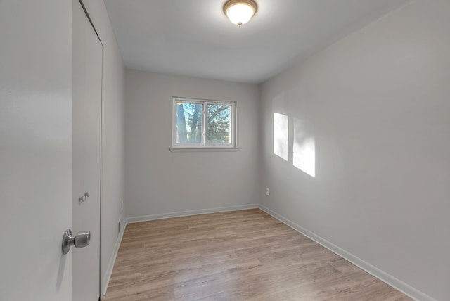 spare room featuring light wood-type flooring