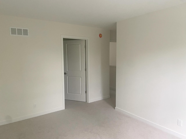 1981 N Shorewood Ln Unit 6, Holland, MI 49423 - unfurnished room with light colored carpet and baseboards