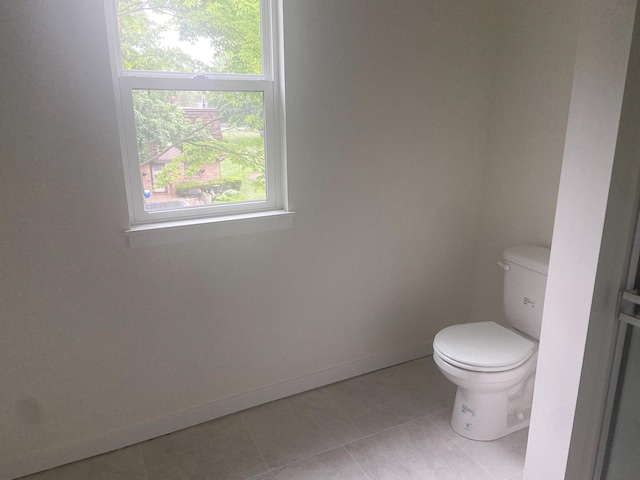 1981 N Shorewood Ln Unit 6, Holland, MI 49423 - bathroom featuring toilet, baseboards, and tile patterned flooring
